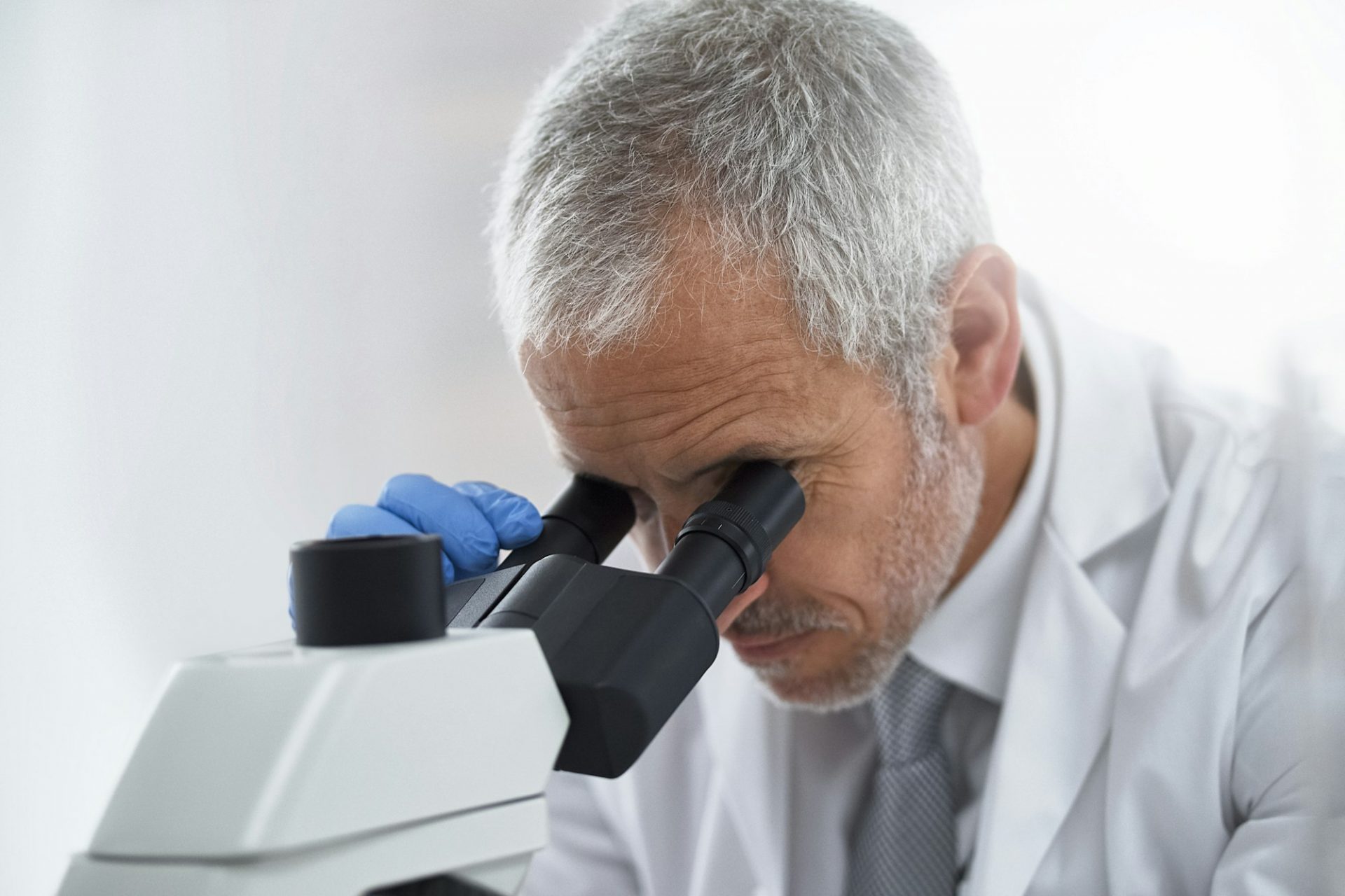 Advancing medicine through research. Shot of a researcher at work on a microscope in a lab.