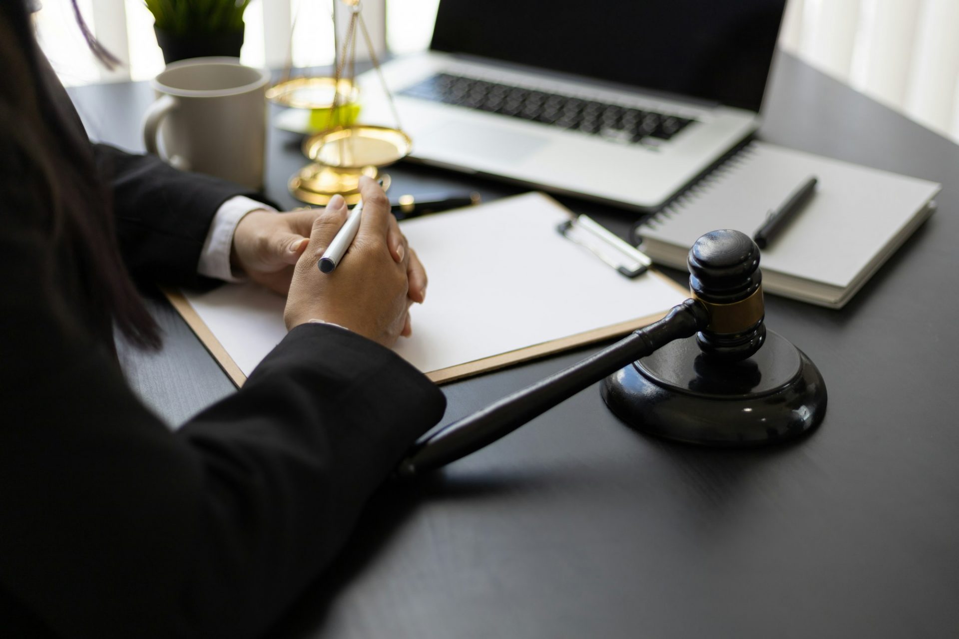 Attorney working on a desk in a law firm.